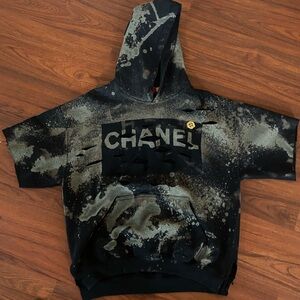 CHANEL Black and Tan Distressed Short-sleeved Hoodie.